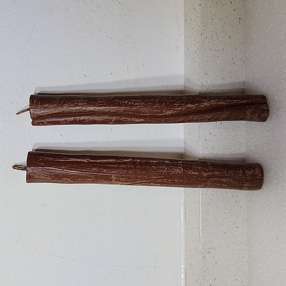 2pc Candle Uniquely shaped as a wood. 8 inches tall 1 inch round